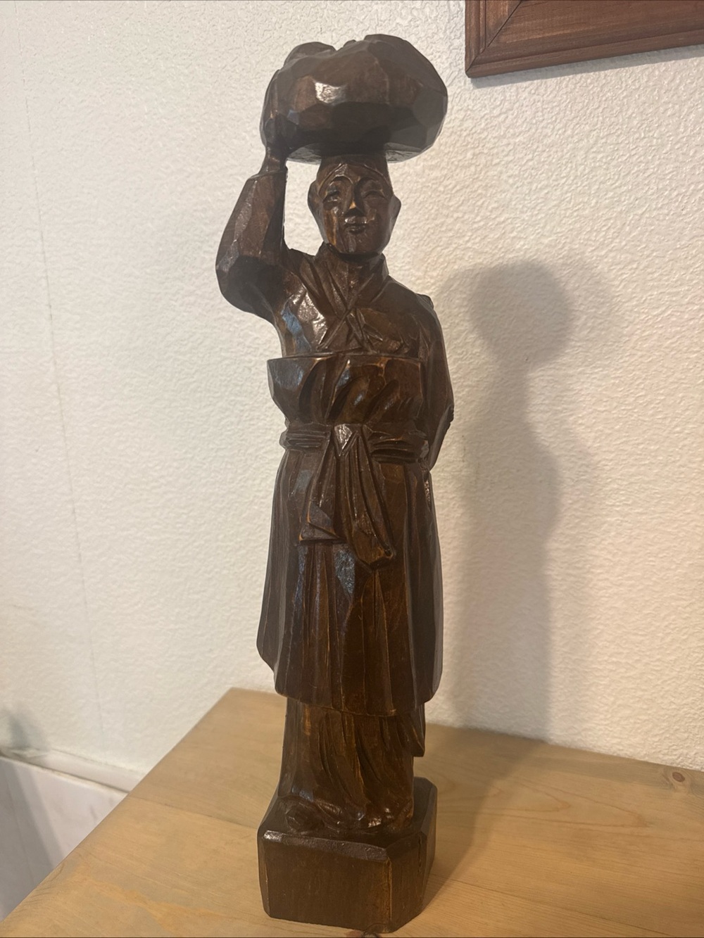vintage hand-carved wooden statue traditional Asian worker